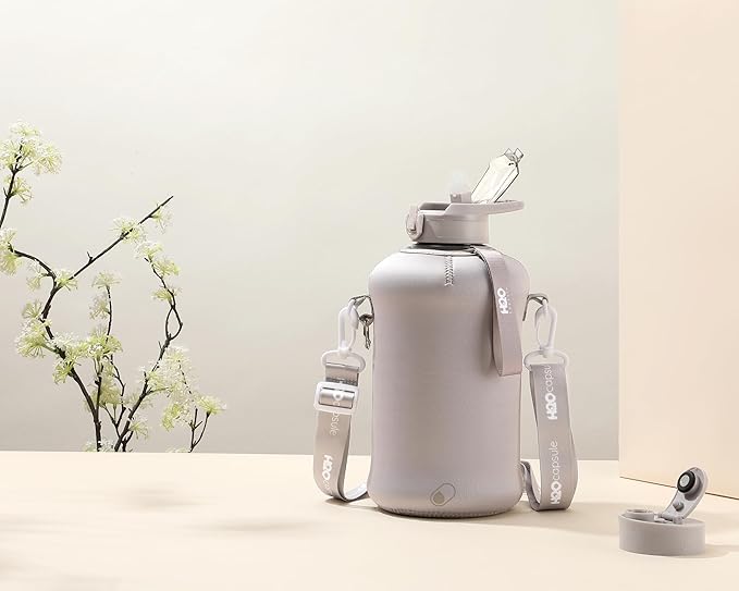 H2O Capsule 2.2L Half Gallon Water Bottle with Storage Sleeve and Covered Straw Lid – BPA Free Large Reusable Drink Container with Handle - Big Sports Jug, 2.2 Liter (74 Ounce)