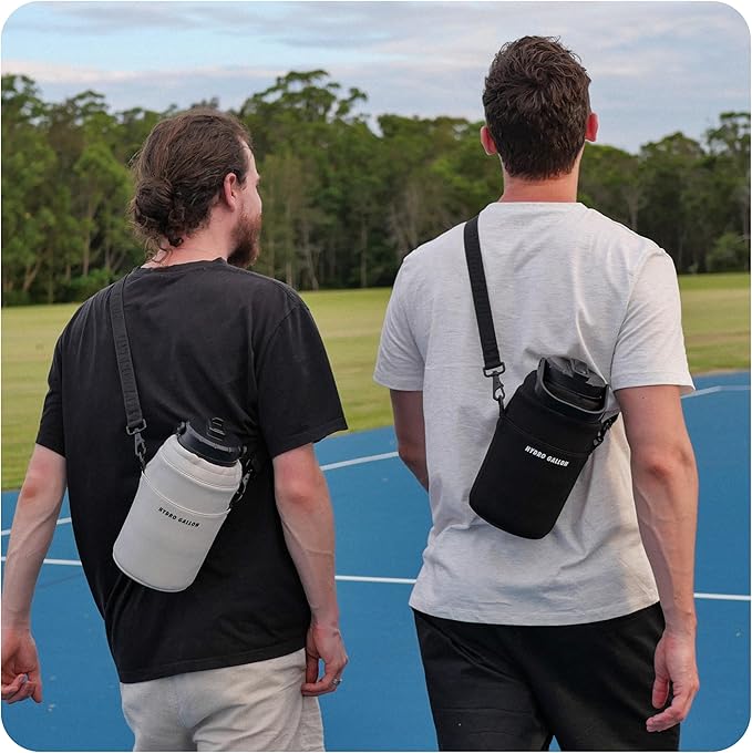 Hydro Gallon® Nomad - Insulated 64oz Half Gallon Water Bottle Jug with Sleeve, Straw Lid, Handle, Strap, Pockets. Large Stainless Steel Metal Gym Thermos. Wide mouth, Leakproof, BPA free. 62oz (Black)