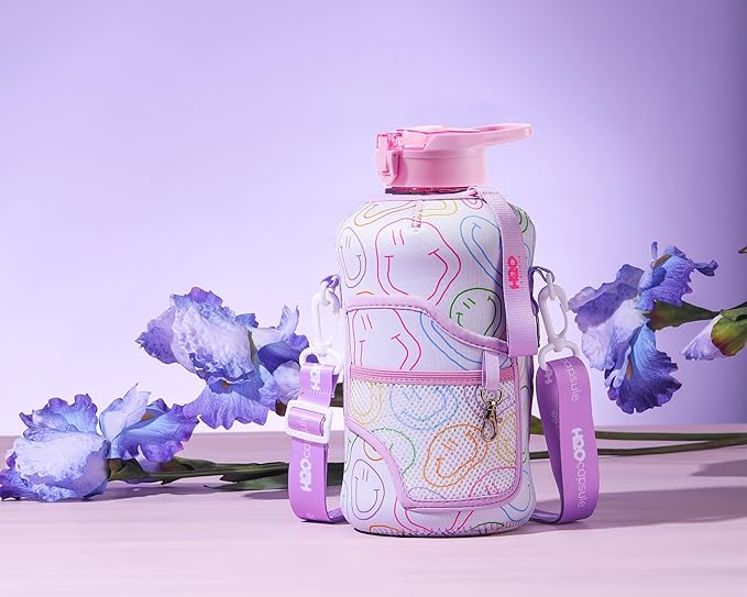 H2O Capsule 2.2L Half Gallon Water Bottle with Storage Sleeve and Removable Straw – BPA Free Large Reusable Drink Container with Handle - Big Sports Jug, 2.2 Liter (74 Ounce), Purple Smiley