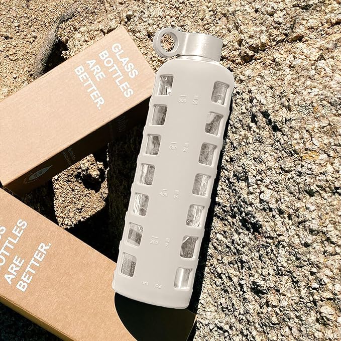 purifyou Premium Glass Water Bottles, 40/32 / 22/12 oz Reusable Drinking Bottle with Time & Volume Markings Silicone Sleeve & Stainless Steel Lid for Water, Coffee, & Fruit Juice (40oz Pearled Ivory)